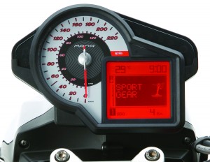 p03137_0201 Analog speedo is paired to an LED display showing ambient and engine temp, time, gear mode, gear position (in manual mode) and one of various fuel and trip functions.