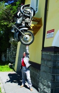 web-IMG_2410 Sue is not really holding up that motorcycle; it merely serves as an advertisement for a motorcycle shop, museum and hostel in Austria.