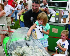 web-Petty-86977577 The spirit of giving is contagious. At gas stops, kids stuffed allowance money into a sidecar, all to help Kyle’s kids. The ride collected almost $53,000 from these spontaneous acts of kindness.