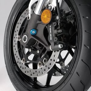 12-Honda-CBR1000RR-wheel 2012 Honda CBR1000RR: Dual radial-mounted 4-piston Tokico calipers provide serious bite; C-ABS is optional.