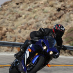 2012-Yamaha-R1-action-lean 2012 Yamaha YZF-R1: A liter-class sportbike like the R1 lives for the curves, on the street or the track.
