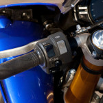 12-Yamaha-R1-left-handlebar 2012 Yamaha YZF-R1: Rocker swtich on the left handlebar sets traction control level. Combined with D-Mode throttle response maps, there are 21 possible combinations.