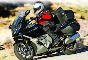 7L1O3764 The BMW K 1600 GTL has sportier handling, more cornering clearance, more power and less weight than the Gold Wing. The tradeoff is less wind protection, comfort and luggage capacity.