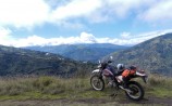 RUNTUN VIEW DR650-WEB An active volcano, Tungarahua, is spewing smoke and ash into the clouds about a mile from this spot, up above the mountain-playground town of Baños. Which shows you why it’s a good idea to stay upwind of an active volcano.