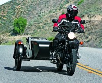 No, this isn’t one of those “dark customs.” The 2012 T side-by-side is Ural’s new stripped-down, low-cost bike-and-sidecar combo, and like the famous Ford you can get it in any color you like (as long as it’s black) for $9,999.