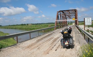 This is part of the old Lincoln Highway, with a Parker truss bridge going over the stream; these steel girder bridges were very popular in the 1920s.