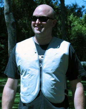 The Silver Eagle Kula-XD Cooling Vest is worn over a base layer shirt and under a jacket.