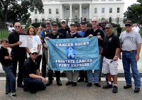 The Prostate Cancer Pony Express arrives at the White House on September 9. Left to right: Alexander Hess Bradin (Robert’s grandson), Robert Hess, Jamecia Muckelvene (Founder and CEO of Warriors Fighting for His Cure), Jim Mayhew, Stuart Ostroff, Richard Peterson, Joe Busby, Tim Davies, Chuck Gough, Arthur, Barry Rosenfeld, and Dave. Kneeling: Jim Schnitzhofer. (Photo courtesy PCAP)