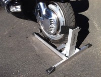The Condor Pit Stop/Trailer Stop holds the motorcycle securely in place, allowing it to stand up on its own.