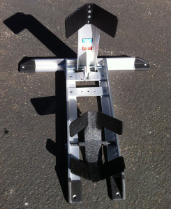 Condor-chock-rear-view The Condor Pit Stop/Trailer Stop has rubberized ends to prevent sliding and has pre-drilled holes for bolting to a trailer or other surface.