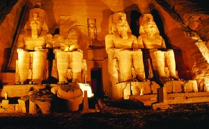 At dusk, I wander about the great temple of Abu Simbel in Egypt, dedicated to the glory of pharaoh Ramses II. The statues are 66 feet high.