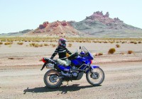 The author poses with her Honda Transalp somewhere in the Iranian desert.