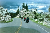 Bikes cruising through the curves and rock formations just south of Mammoth Hot Springs.