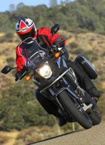 web-WING8966 Optional tall windscreen, light/protection bar, lower wind deflector cowl and luggage were installed on our NC700X test bike.