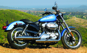 web-IMG_0068 Exuding cool in its Cool Blue paint, the Harley Sportster SuperLow puts feet forward and bars sweeping back. Updated rear suspension offers a little more travel than the 2010 model, but minimal ground clearance still makes it want to shy away from speed bumps. NORTH