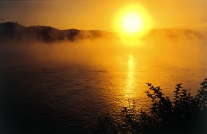 Sunrise over the Missouri River on a misty morning at Fort Randall, South Dakota.