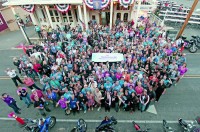 A beaming crowd peers up from Main Street in Virginia City where the AMA provided a delightful Western-style cookout and party. (Photo Courtesy of the American Motorcyclist Association)