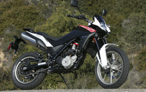 Husqvarna-TR650-Strada-beauty-right The street-focused Strada has cast 19-/17-inch wheels and standard ABS.