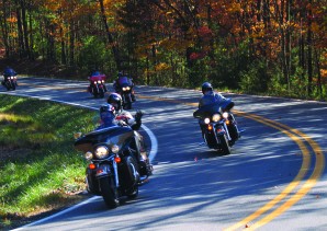 Riders enjoy the afternoon rolling through the curves and autumn splendor on State Route 52.