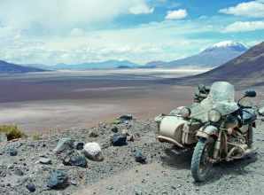Having recently left Bolivia and entered Chile, I was astonished by even more incredible snowcapped volcanoes and breathtaking vistas that had me constantly stopping in admiration. In this region of South America, many of these high-altitude alkaline or saline lakes host flocks of Andean Flamingos. For another two days, I was able to enjoy this barren paradise before making my way to Antofagasta along the coast of Northern Chile, where I managed to catch the Dakar Rally.