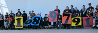 Children and participants hold up signs to announce the total number of dollars raised in the 2013 Harley-Davidson Ride for Life event. More than $1 million was raised to fuel the fight against muscle disease in support of local families served by the Muscular Dystrophy Association.