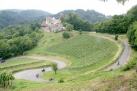 We rode from Ljubljana, Slovenia, to Graz, Austria, and had lunch at a restaurant overlooking this castle and a twisty road.
