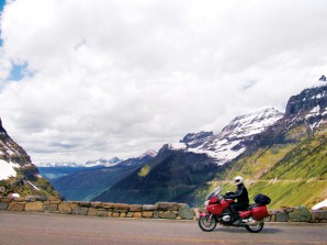 In the background, Going-to-the-Sun Road clings precariously to the western flanks of Logan Pass in Montana.