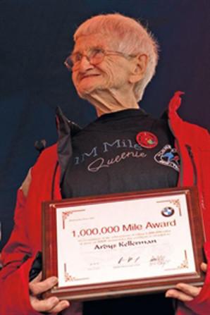 Ardys Kellerman receives an award for covering one million miles on BMW motorcycles. (Photo courtesy of BMW MOA)