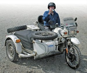 Hubert always gets the shot. He rides using a throttle lever on the left handlebar, while his right hand wields the camera.