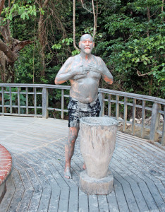 That ugly fellow is covered in warm volcanic mud which is supposed to make a person more beautiful; it did not work with him.