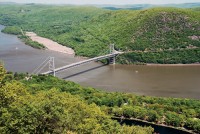 The Hudson River flows beneath the Bear Mountain Bridge, as seen from a Bear Mountain overlook.