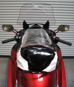 The removable map pocket lays on top of the zippered compartment. The buckles secure the rolled-up end of the dry bag.